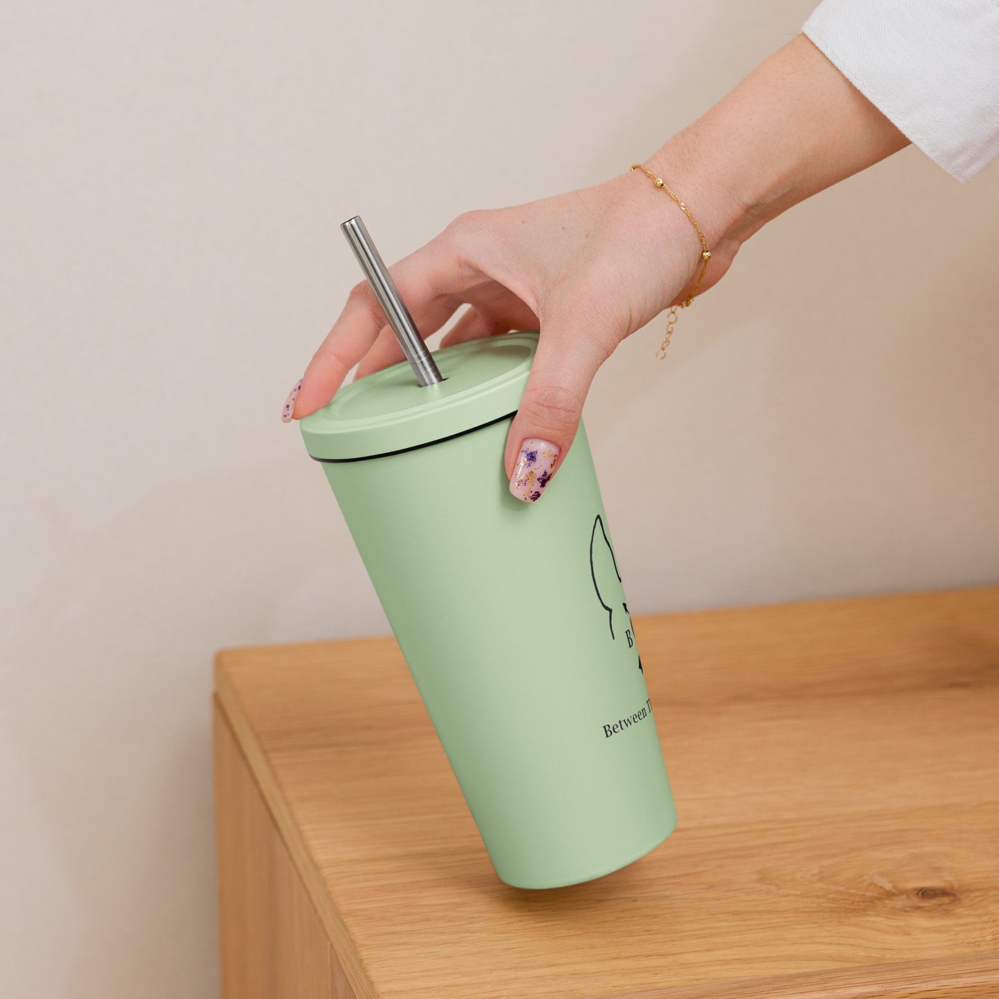 Insulated tumbler with a straw